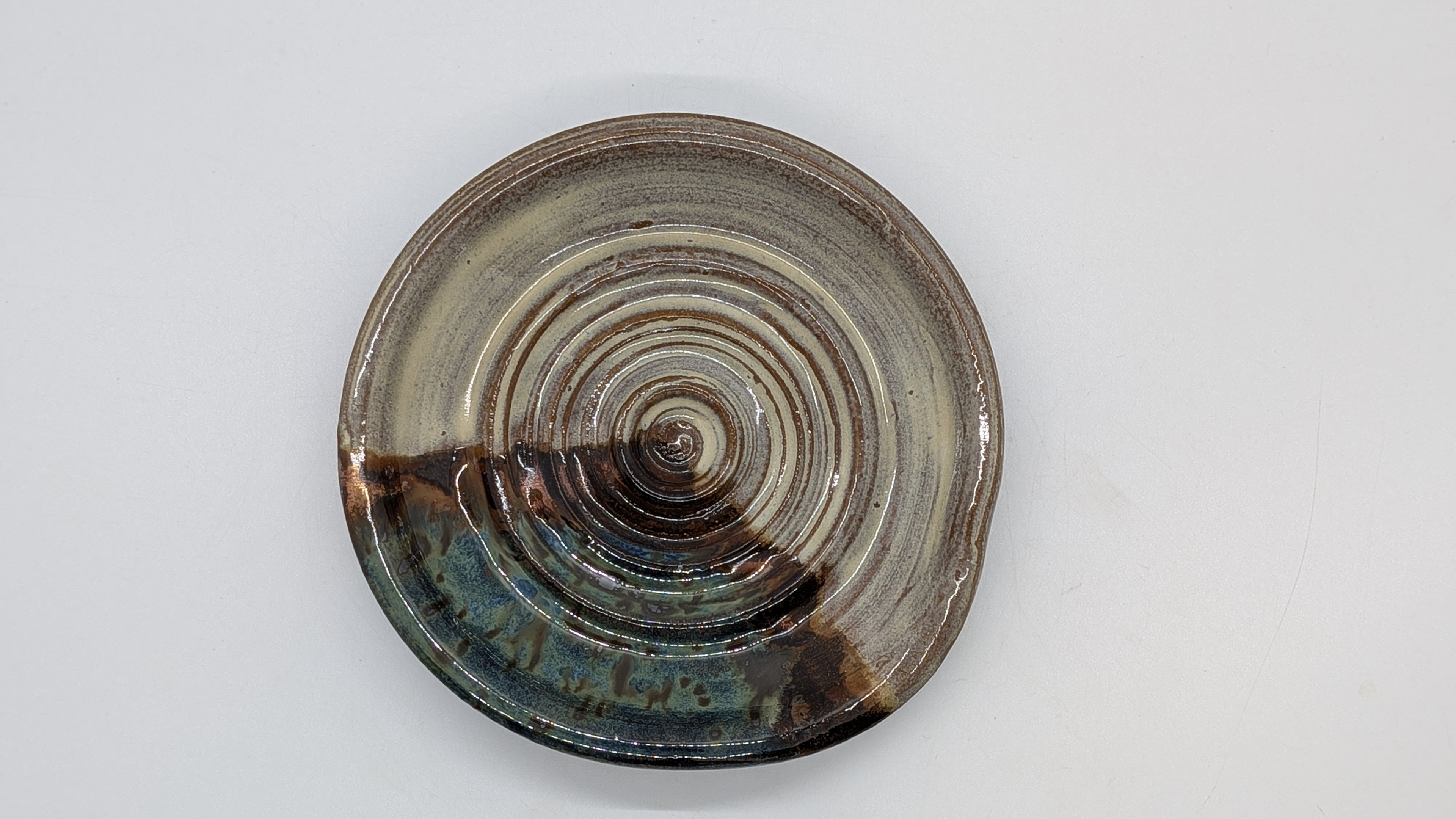 Rain on Copper Spoon Rest - Pairs nicely with my Cool Sepia Prep Bowls, as well as the Turquoise & Copper sets. This spoon rest uses the same, Cool Sepia glaze combo - with a pop of blue and copper - 15